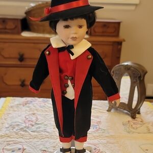 Elegant Black and Red Toy Doll with Hat